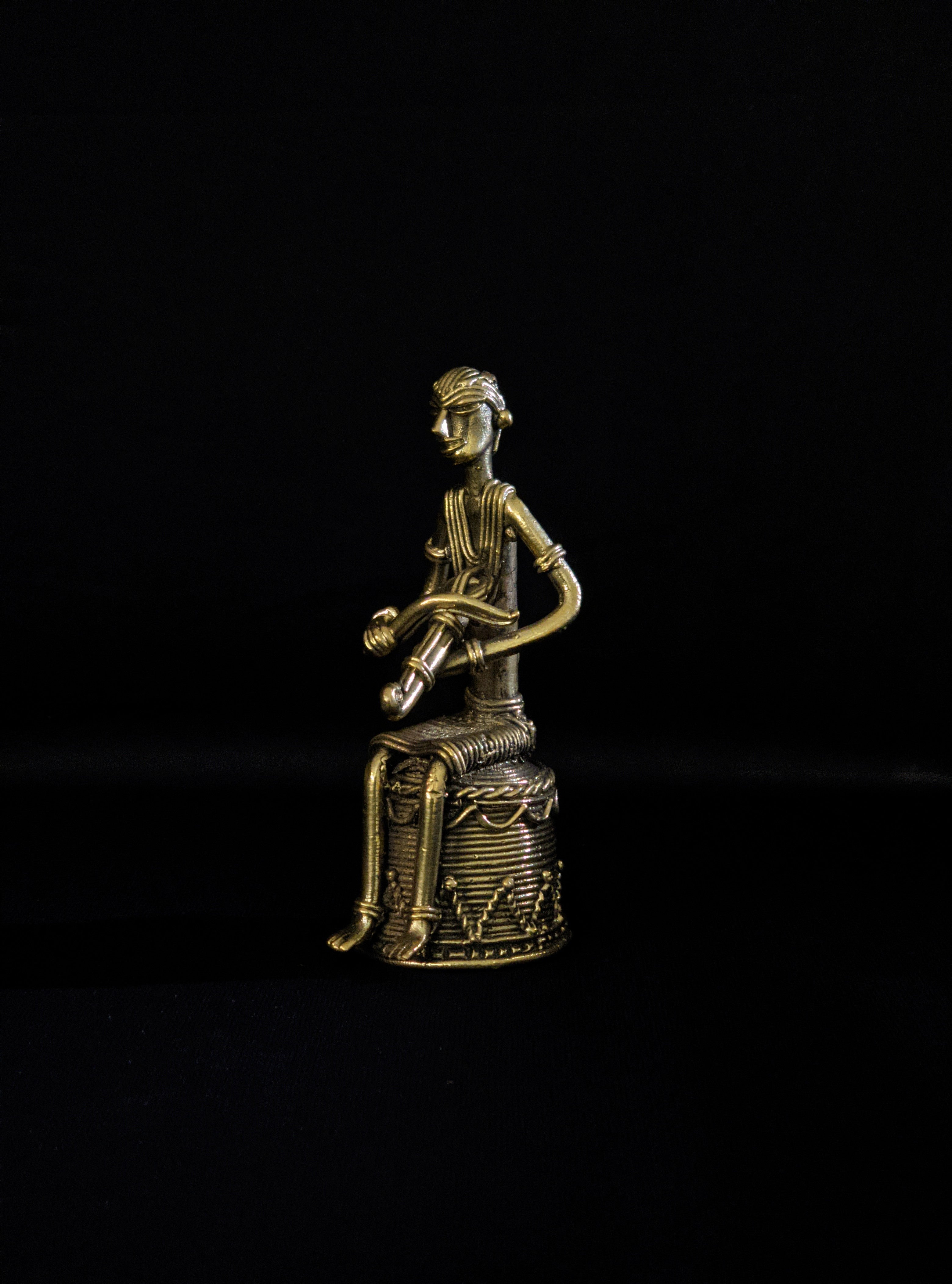 Dhokra - Tribal Musician sitting on base playing Kendra(1 PICES)