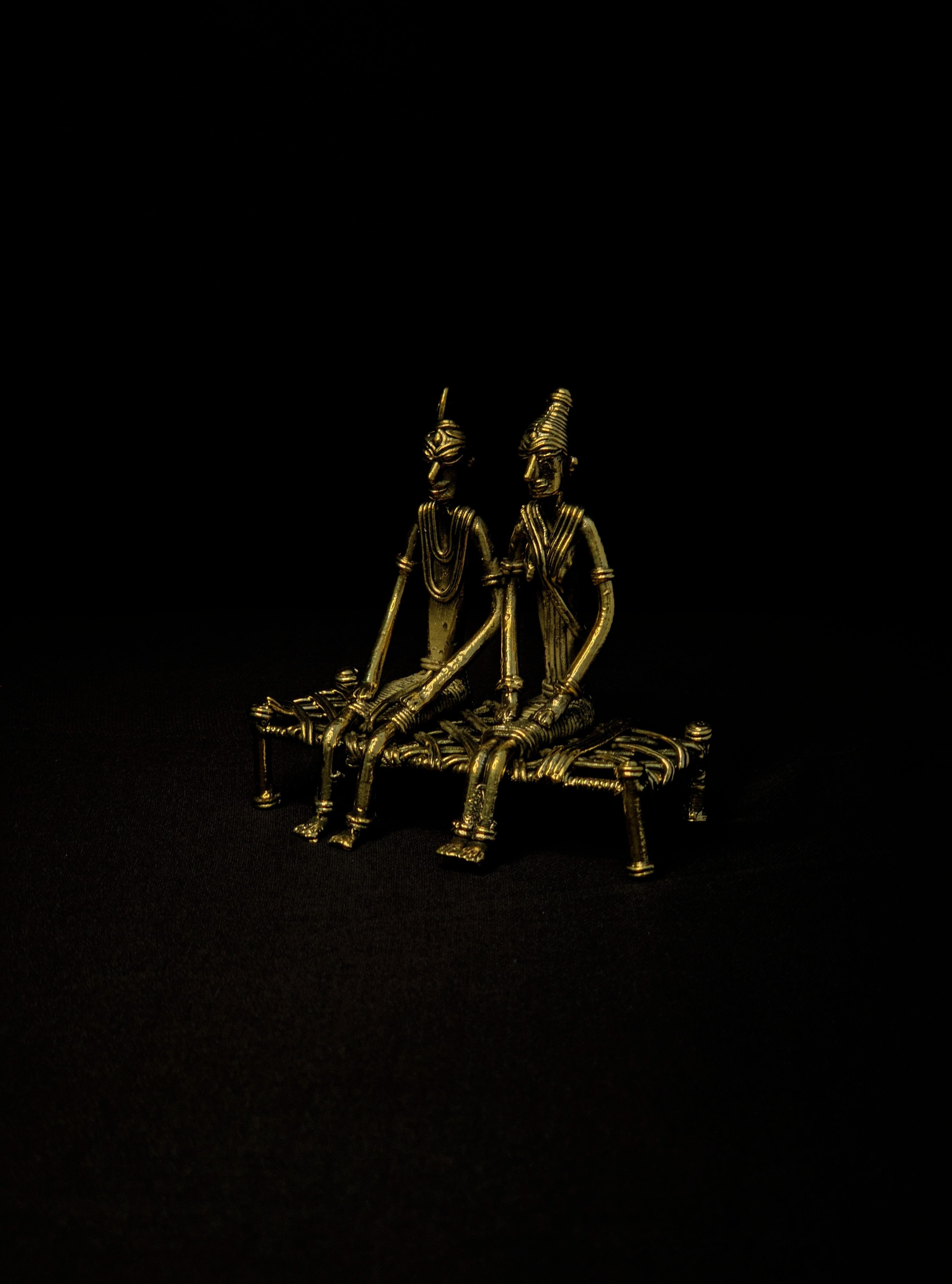Dhokra - Tribal Couple sitting on Bed