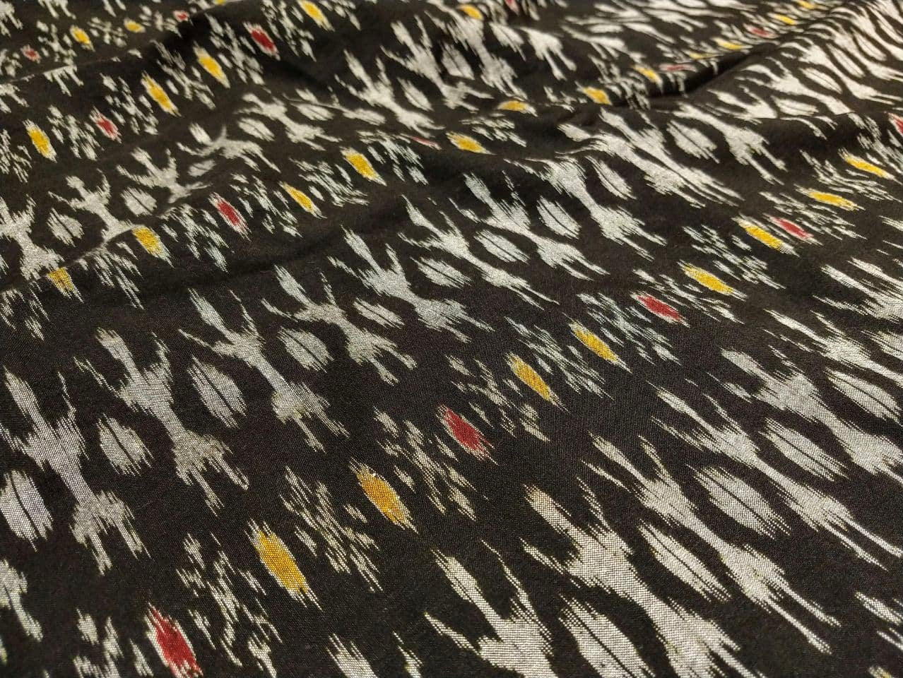 White Tribal on Black with Red & Yellow Motif Cotton Ikat Handloom Fabric - IndianVillèz